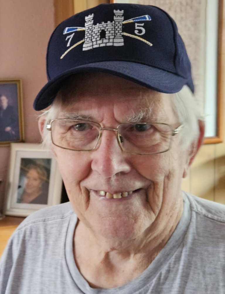 Mike wearing the cap he had made to mark the 75th year of Cantabs