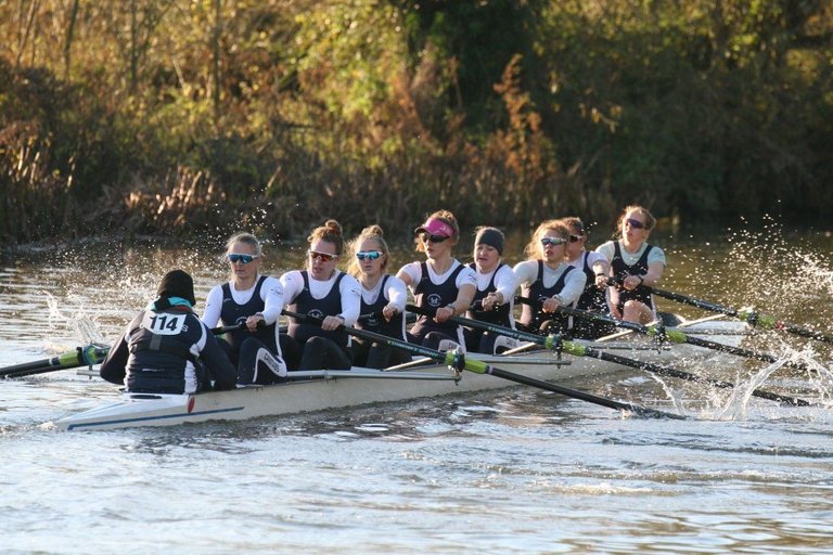 The winning women's 8+ from the event racing down first post reach